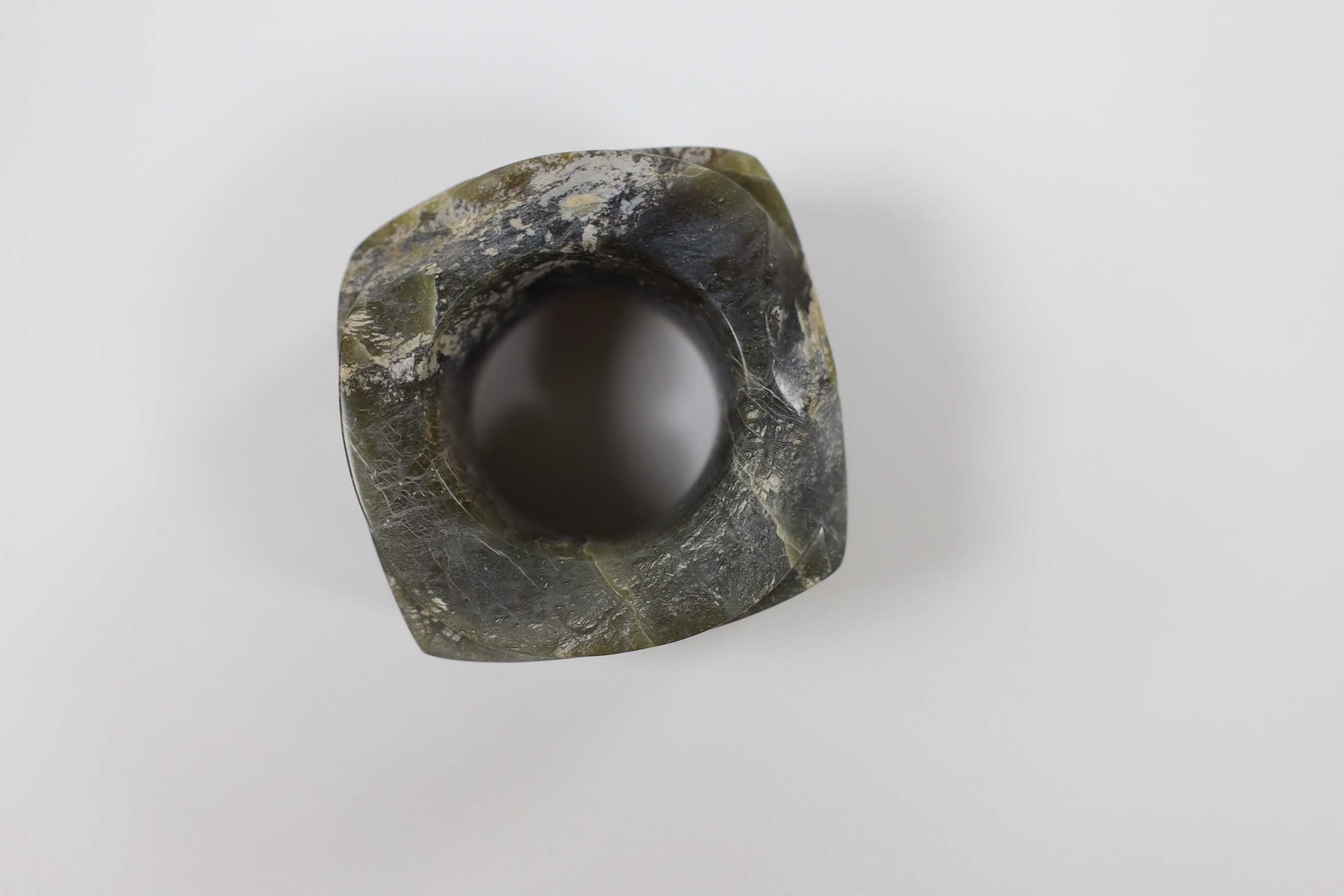 A Chinese bronze hand warmer, together with an inscribed inkstick, 16cm wide, and a hardstone carving